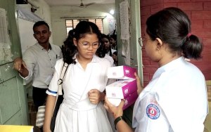 The students are receiving lunchboxes after finishing the session